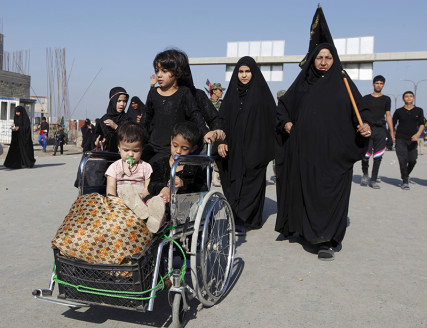 Shi'ite Muslim pilgrims travel to the holy city of Kerbala, ahead of the holy Shi'ite ritual of Arbaeen, in Baghdad