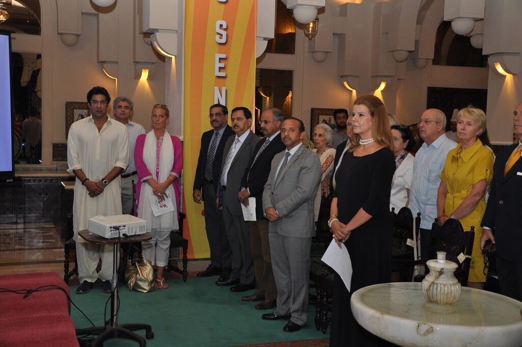 Guests including Wasim Akram & wife  standing for national anthem at launch event of KKAWF in Islamabad