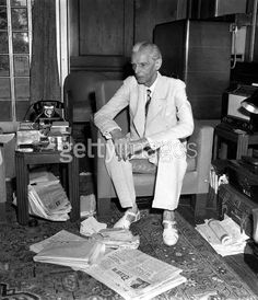 Jinnah in his study