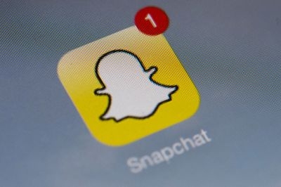 The logo of mobile app Snapchat is displayed on a tablet on January 2, 2014 in Paris