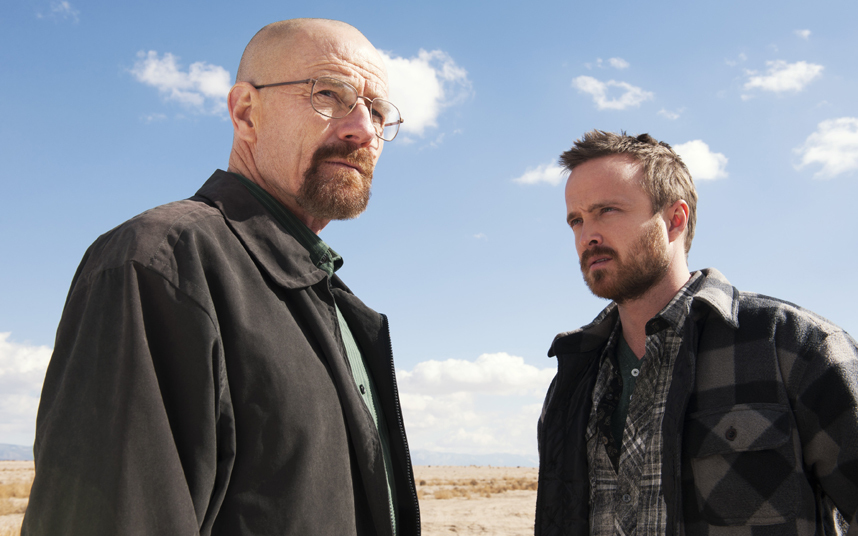This image released by AMC shows Bryan Cranston, left, and Aaron Paul in a scene from "Breaking Bad." Paul is nominated for best supporting actor in a drama series for his role as Jesse Pinkman. The Academy of Television Arts & Sciences' Emmy ceremony will be hosted by Neil Patrick Harris. It will air Sept. 22 on CBS. (AP Photo/AMC, Frank Ockenfels )