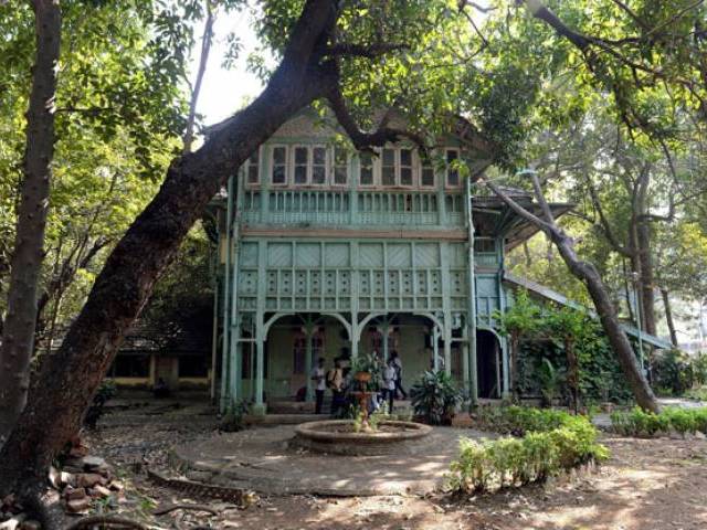 In this photo taken on February 5, 2016, Indian students gather under the porch of the Kipling Bunglow - the birthplace of author Rudyard Kipling - inside the campus of the J.J. School of Art in Mumbai -courtesy AFP 