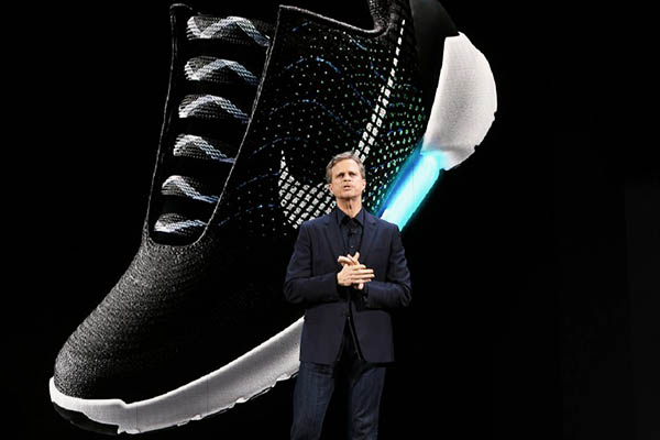 Nike president and CEO Mark Parker reveals their latest innovative sports products during an event in New York on March 16, 2016. Nike revealed a series of products highlighted by the groundbreaking ìadaptive lacingî platform, as well as a pioneering technology that separates mud from cleats and transformations in the celebrated innovations of Nike Air and Nike Flyknit. / AFP / Jewel SAMAD