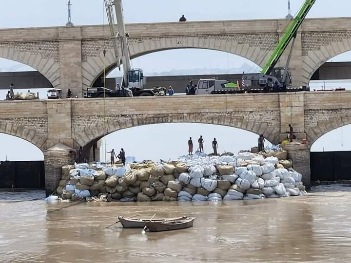 Temporary dam breaks due to increased water pressure during repair work at Sukkur Barrage