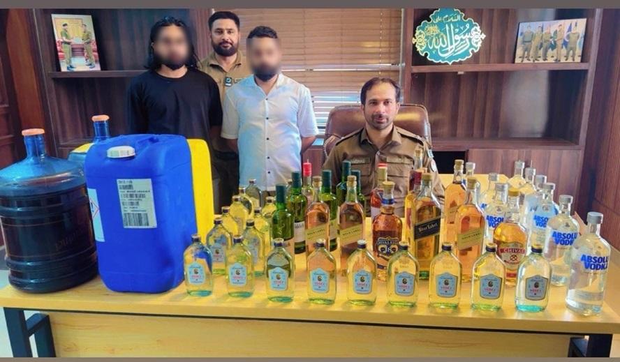 Large consignment of local and imported liquor seized; two suspects arrested.