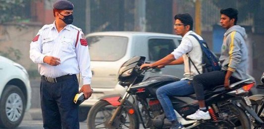 police fining bikers without helmets