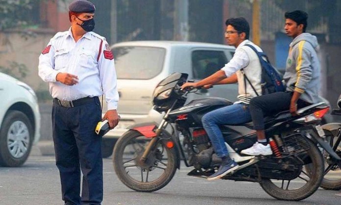 police fining bikers without helmets