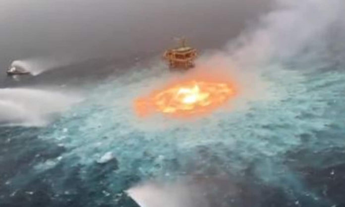 gulf of mexico and fire erupts