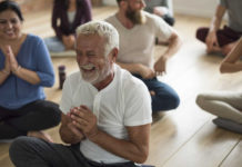 What Is Laughter Yoga? Here's What You Need To Know
