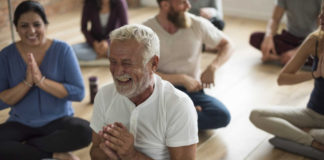 What Is Laughter Yoga? Here's What You Need To Know