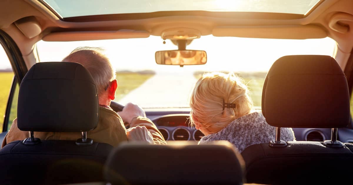 elderly driving on the road and giving way