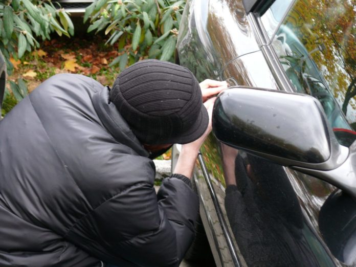 Man Stealing Car