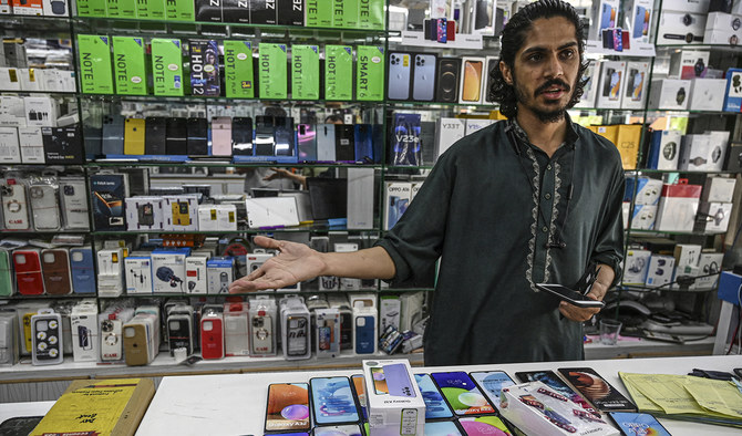 Shopkeeper Selling Phone
