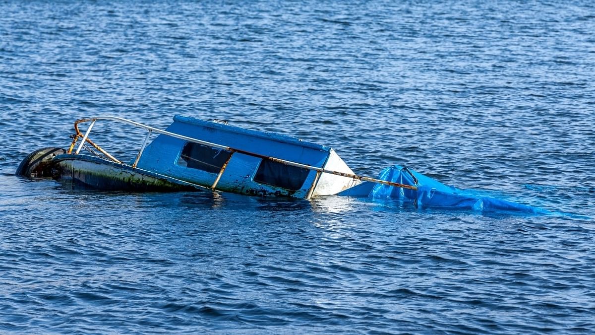 At least 20 migrants missing as boat sinks off Italy, seven rescued