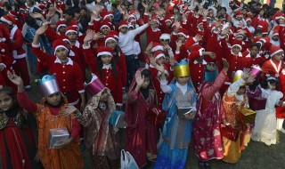 Pakistani Christians hold placards during a peace rally ahead of Christmas celebrations in Lahore